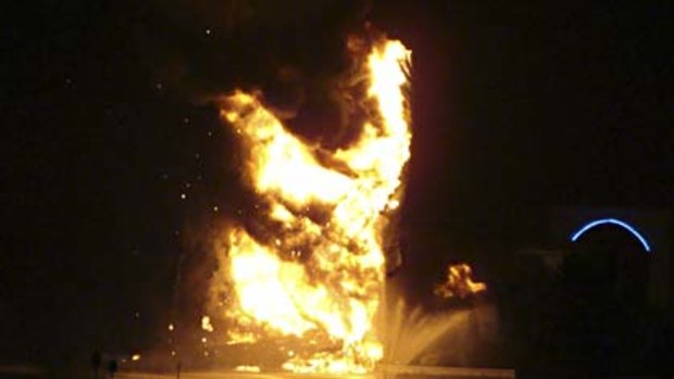 Holy smoke ... the Jesus statue goes up in flames after being struck by lightning.