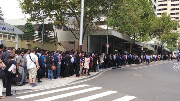 Long wait &#8230; passengers queue outside North Sydney railway station on Monday morning after rail services to Chatswood stopped.