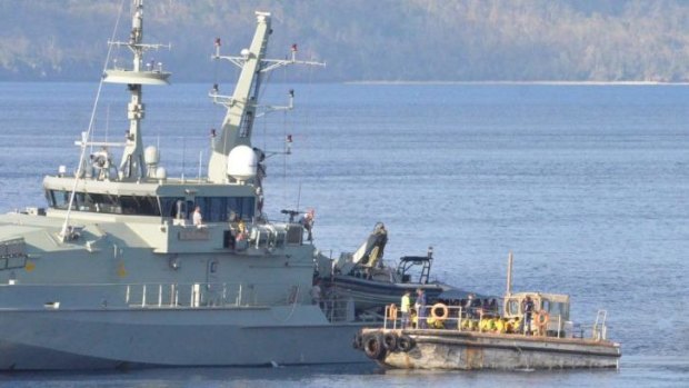 An asylum seeker boat carrying refugees arrives on Christmas Island on November 20, 2012. The Australian navy has escorted eight boats back to Indonesian waters since December 19, 2013.  