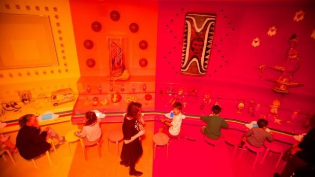 In living colour: Children playing with the digital drawing tools in the Rainbow Room of the <i>Express Yourself: Romance was Born</i> exhibition.