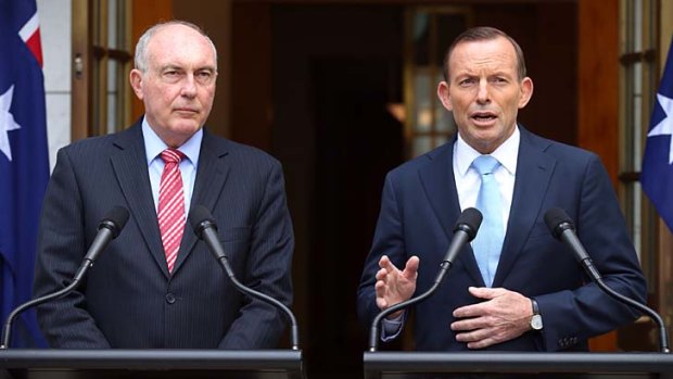Prime Minister Tony Abbott with National Party leader Warren Truss announcing the second airport at a press conference in Canberra yesterday.
