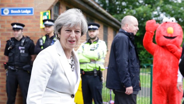 Prime Minister Theresa May and Elmo at a polling station in Maidenhead, England. 