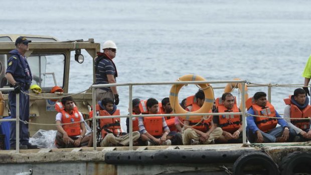 Cargo of misery: Asylum seekers arrive at Christmas Island after Indonesia refused permission for the vessel to return to a port.
