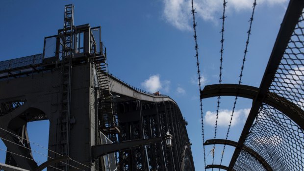 Workers on top of Sydney Harbour Bridge are installing 130 vintage lights. So far,  21 have been installed, mostly on the eastern side at the bridge's southern end.
