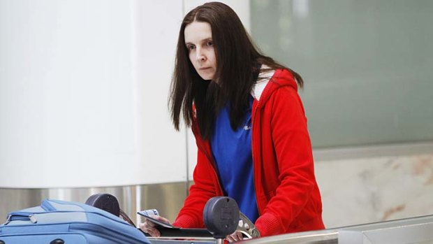 Return: Allyson McConnell arrives back in Sydney Airport on Wednesday.