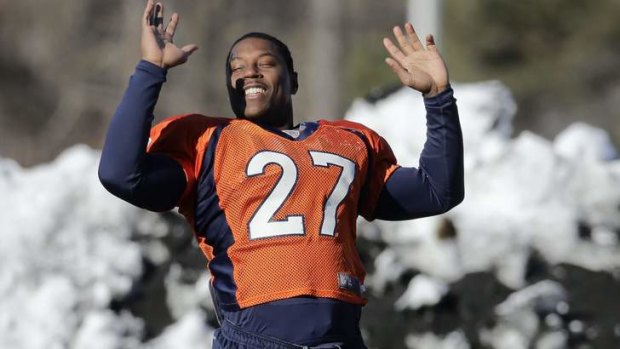 Cold stretch: Bronco Knowshon Moreno limbers up during a snowy training session this week.