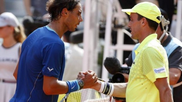 Rafael Nadal shakes hands with compatriot Roberto Bautista Agut after the semi-final.