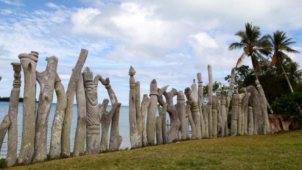 Carved totem poles near Saint Maurice Beach, Isle of Pines.