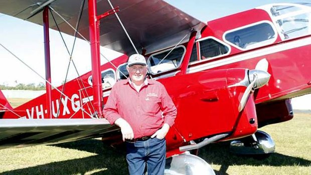 Des Porter with the restored bi-plane which was used in the 1930s by the Royal Flying Doctor Service.  <B><A href= http://www.caboolturenews.com.au/story/2012/10/01/police-search-missing-plane/ > Photo: Nicola Brander, Caboolture News  </a></b>