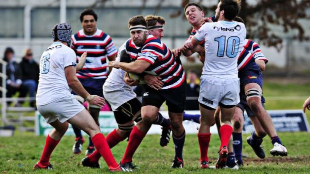 Easts player Danny Messenger tries to make a break against Queanbeyan at Campese Field.