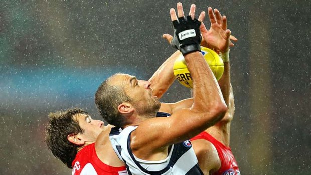 Geelong's James Podsiadly takes a mark under pressure.