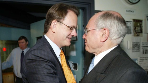 Opposition Leader Mark Latham giving then Prime Minister John Howard a power handshake during the 2004 election campaign. Which was, coincidentally, the closest he ever got to power.