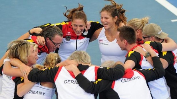 Anna Petkovic and Julia Goerges of Germany celebrate with teammates after defeating Australia in a Fed Cup semi-final tie in Brisbane last weekend.