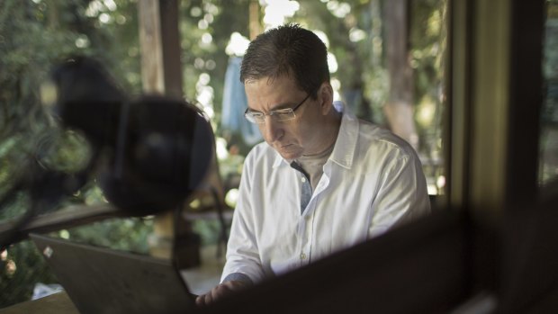 Glenn Greenwald, working at his home in Brazil.  