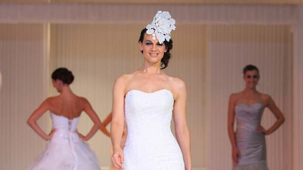 White goods: Models in a  fashion parade at The 2013 Bridal Expo.