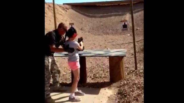 This video still shows shooting instructor Charles Vacca standing next to a 9-year-old girl moments before she shot him dead at the Last Stop shooting range at Bullets and Burgers in White Hills, Arizona.