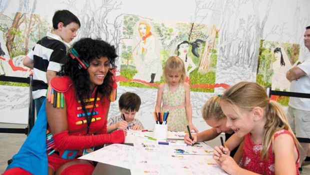 Heartfelt ... Arlene TextaQueen with visitors to her <i>Unseen superheroes of the working world</i> workshop in Brisbane.