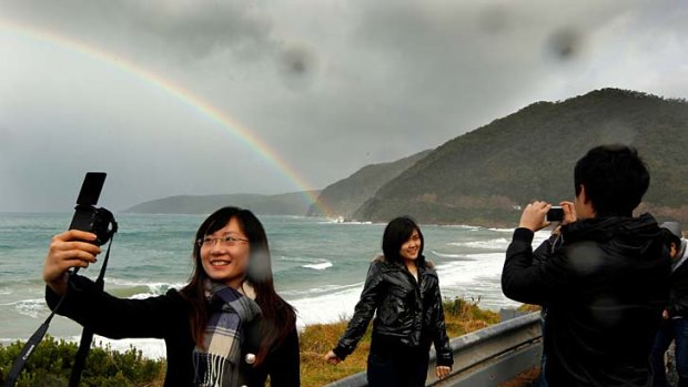 China boom... tourists at a Great Ocean Road lookout.