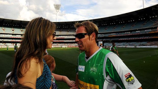 Big stars, small crowd. Shane Warne with girlfriend Liz Hurley before the first Melbourne Stars match at the MCG.