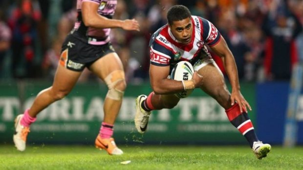 Too easy: Michael Jennings goes over for the Roosters in what was a comfortable win over the Tigers.
