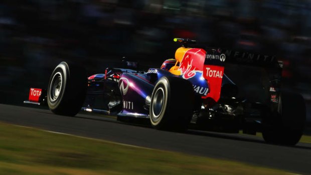 Front man: Mark Webber of Red Bull pushes to win pole position at Suzuka.