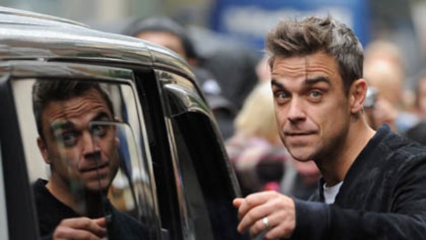Robbie Williams says he's mobile phone was hacked in to.