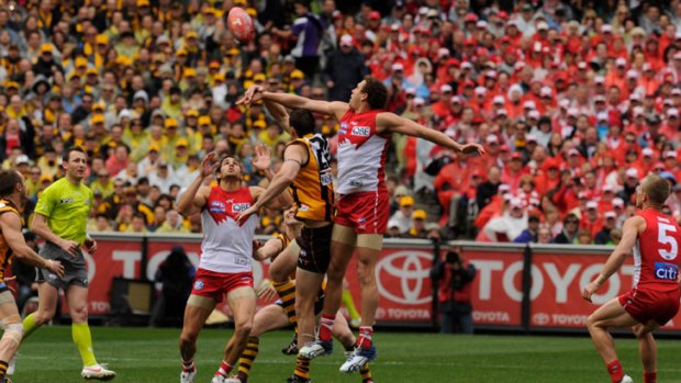 Shane Mumford flies in the ruck for Sydney.