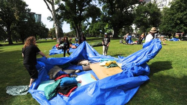 Occupy Melbourne protesters pack up gear in Treasury Gardens.
