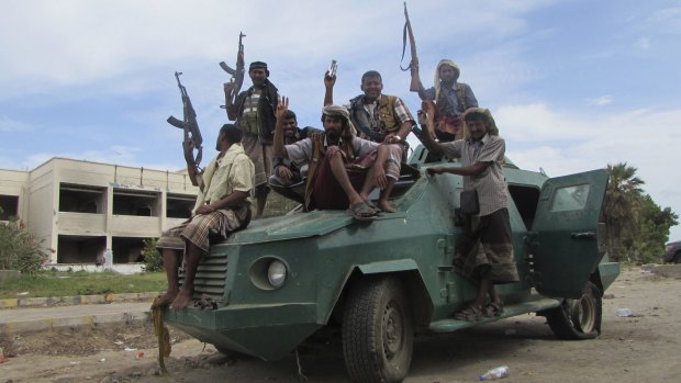 Militiamen loyal to President Abd-Rabbu Mansour Hadi ride through Aden last week.