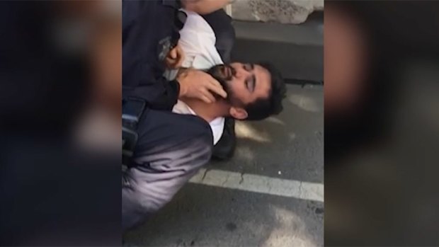 A still from a video purporting to show the arrest of the driver of a car that plowed into people on Flinders Street on Thursday.
