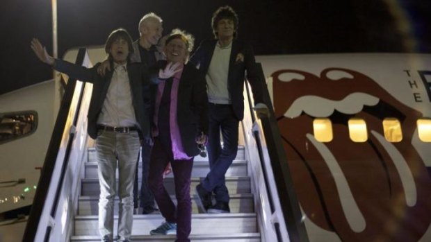Rolling Stones singer Mick Jagger leads the rest of the band down the steps, with Keith Richards, front centre, Ronnie wood, right,  and drummer Charlie Watts, as the rock group arrive in Ben Gurion airport near Tel Aviv.  