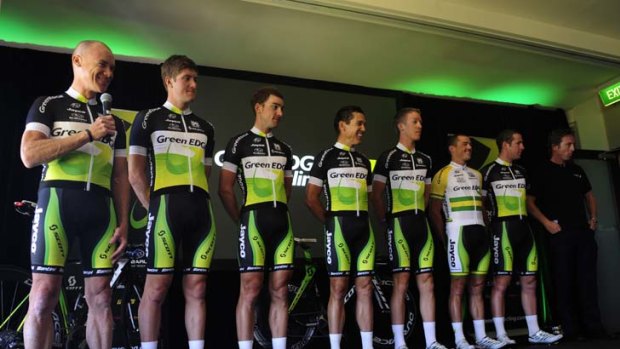 Time for the big reveal &#8230; Stuart O'Grady, left, is accompanied by his teammates as he shows off GreenEDGE's racing strip in Adelaide yesterday.
