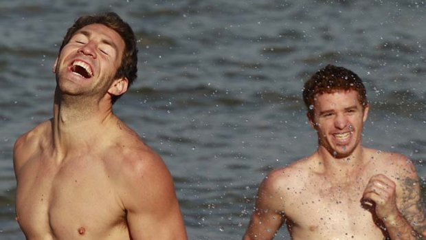 Making a splash: Travis Cloke ( left) and Kirk Ugle at St Kilda beach.
