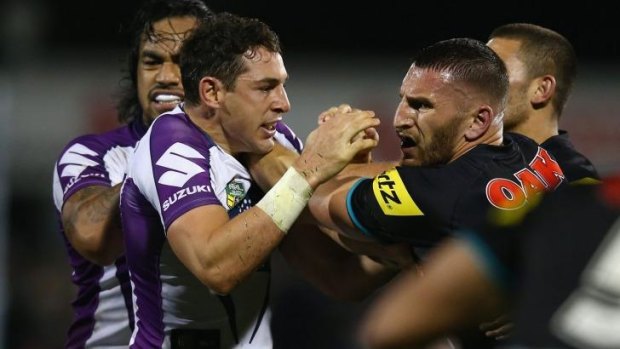 Stormy affair: Billy Slater and Lewis Brown square up.