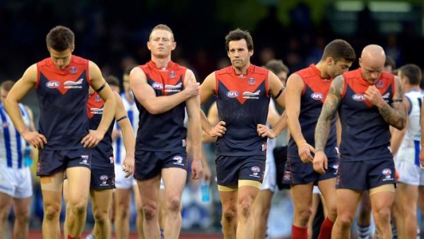 Bad day: Demons players leave Etihad Stadium as 20-goal losers, even though the Kangaroos at times were far from flawless.