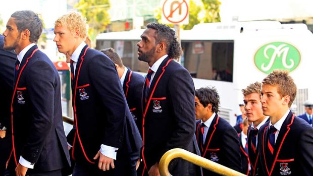 Melbourne mourns: The players at Jim Stynes' funeral.