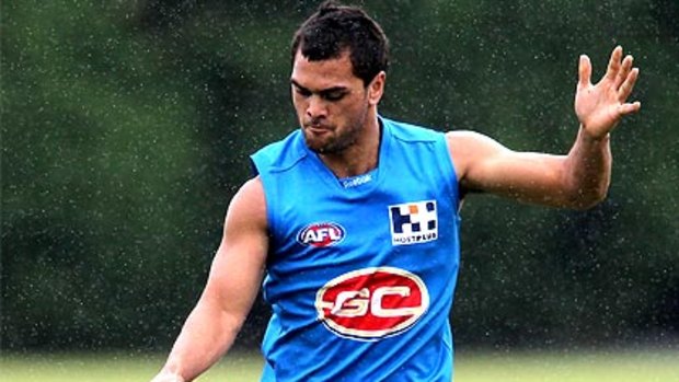Karmichael Hunt goes through his paces at his first training session on the Gold Coast.