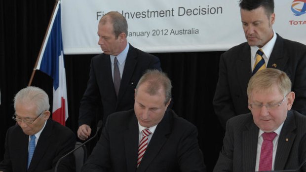 Sign here: Resources Minister Martin Ferguson (right) and project partners in Darwin yesterday.