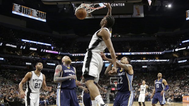 Slam dunk: Kawhi Leonard throws one down for the Spurs.