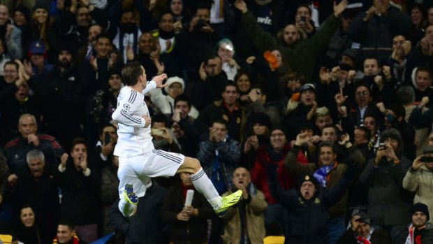Jumping for joy: Gareth Bale celebrates his goal.