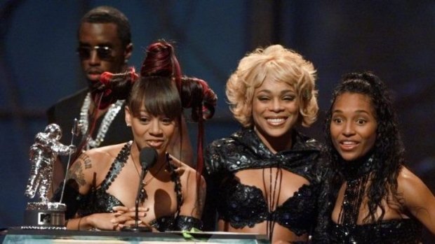 Then there were three: (From left) TLC's Lisa "Left Eye" Lopes with T-Boz and Chilli accepting an MTV award in 1999, with Sean Combs behind.