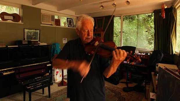 With strings attached: Carl Pini at his home, playing a Chinese copy of a Guarneri del Gesu once owned by the violinist Fritz Kreisler.