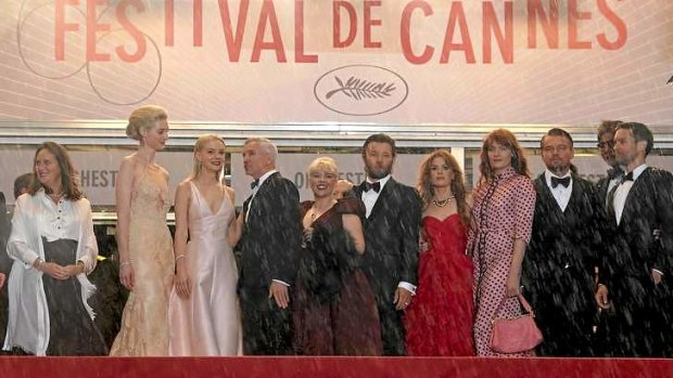 Baz Luhrmann and Catherine Martin on the soggy red Cannes carpet with cast members of the <i>The Great Gatsby</i> at the opening ceremony of the famed film festival.