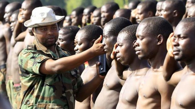 M23 camp commandant Major Innocent Madido  inspects new recruits last week in eastern Democratic Republic of Congo.