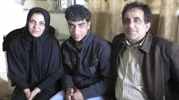 Detained at night ... Sayyed Awad (centre) with his mother Bushra Omar Awad and father Mohamed Mahmoud Awad in Beit Omar.