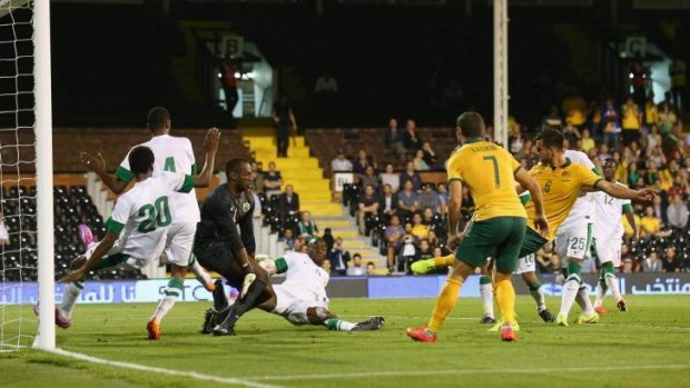 Bailey Wright scores the Socceroos' third goal against Saudi Arabia on Monday.