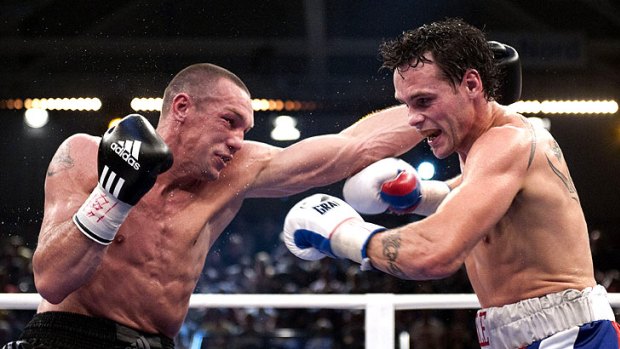 Sebastian Sylvester (left) throws a punch during his IBF middleweight title fight with Daniel Geale.