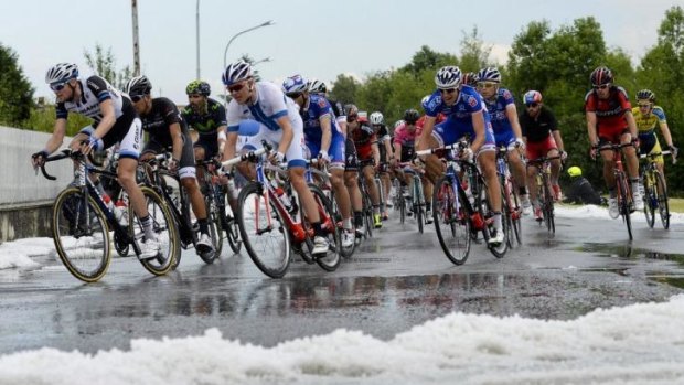Hail to the riders: The Giro d'Italia field is forced to deal with a stage 13 thunderstorm.