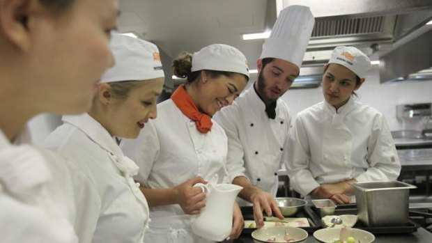 Catering for demand: Chef Tim Gatt with students (from left) Kyuhee Jang, Monica Duque, Alessandra Ortiz and Pearl Kitirattanakar.