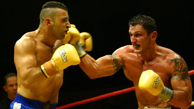 Wissam Fattal (left) in a kickboxing match in 2004.